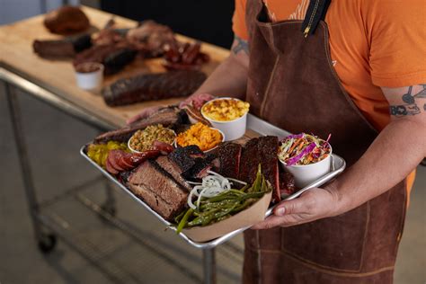 Prime bbq - Three racks of St. Louis ribs or baby back ribs + four half BBQ or Alabama chickens + your choice of two double portions of: sausages | tri tip | pulled pork | rib tips | sliced brisket + a large tossed green salad + your choice of three super-sized, swoon-worthy sides. Photo.
